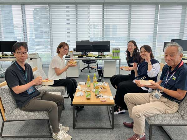 Colleagues having breakfast together
