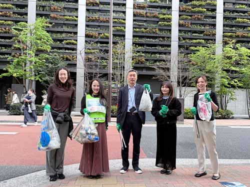 Employees attending a cleanup challenge in the local district